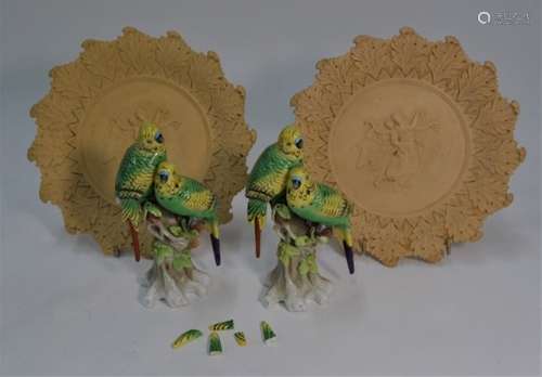 Two 19th century bisque plates and two parrot models