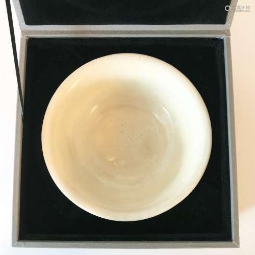 A White-Glazed Bowl with string pattern at the bottom,