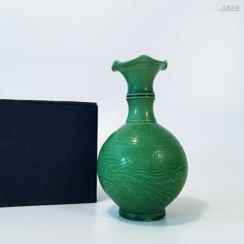 A Green-glazed Flower-head flask with carved design,