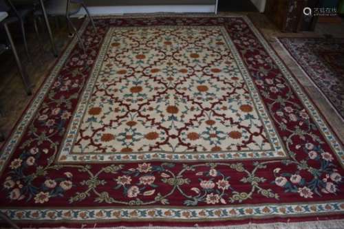 A handmade Turkish Lal carpet, the ivory ground with linked vine design, 321cm x 242 cm
