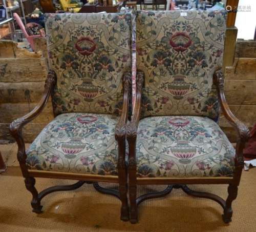 A pair of continental walnut framed open armchairs