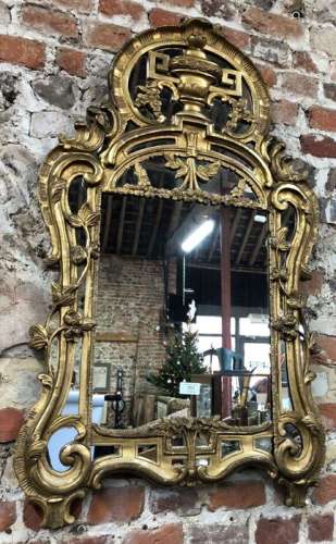 An antique giltwood framed mirror