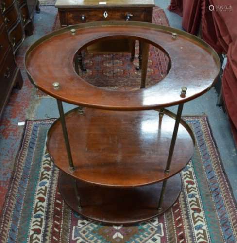 A 19th century campaign washstand, the three ovoid mahogany tiers each with a 3/4 brass gallery