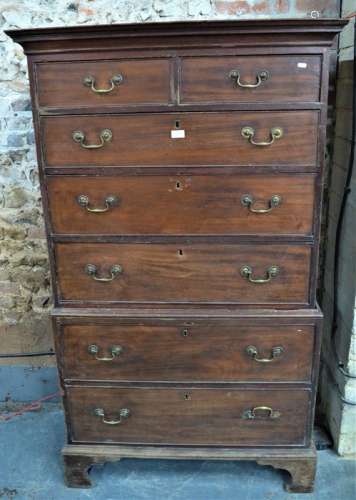 A George III mahogany chest on chest the two short over five long graduated drawers
