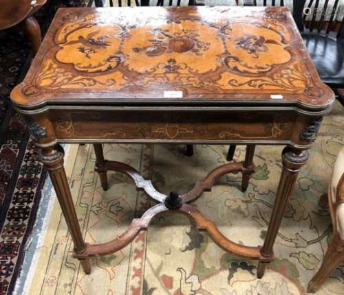An antique marquetry card table, the hinge-over revolving top with lobed corners and green baize lin