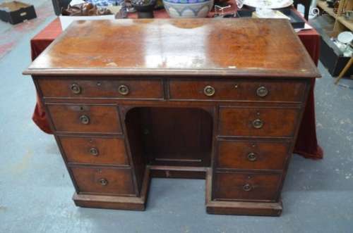 A Victorian mahogany knee-hole campaign style desk