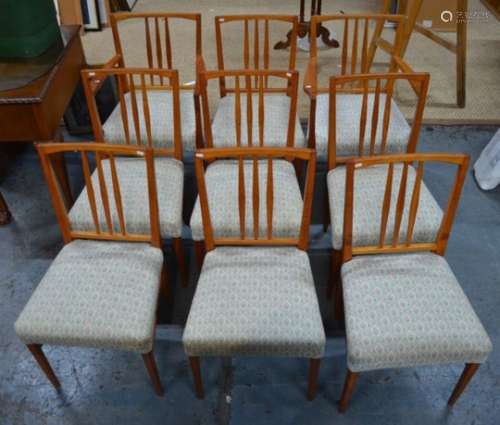 A set of ten Heals hardwood dining chairs comprising eight side chairs and a pair of carvers