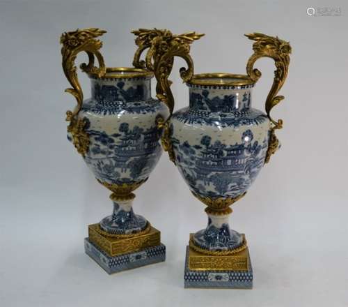 A fine quality pair of modern blue and white Chinoiserie-painted baluster garniture vases