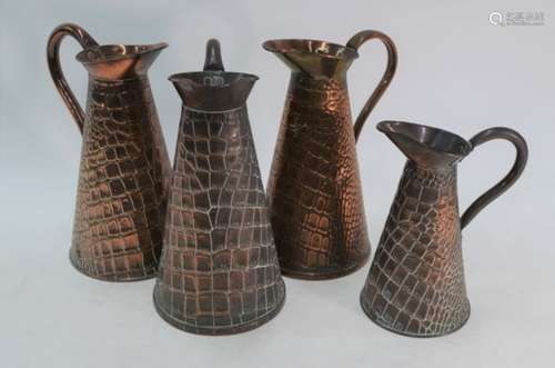 Four Arts & Crafts copper tapering jugs