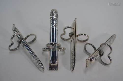 An unusual set of four pairs of electroplated asparagus-eater's tongs