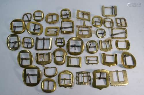 A collection of 19th century brass and wrought iron harness-buckles