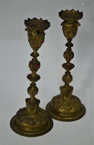 A pair of 19th century cast brass ornate baluster candlesticks