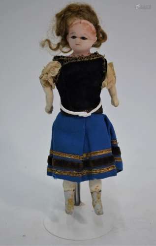 A 19th century wax-headed costume doll