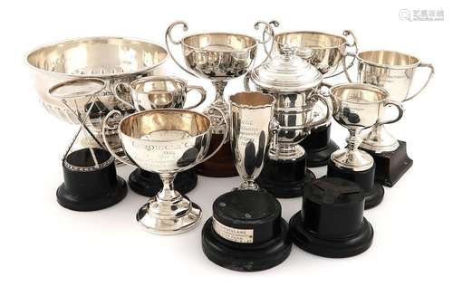 A small collection of silver golf trophies, compri…