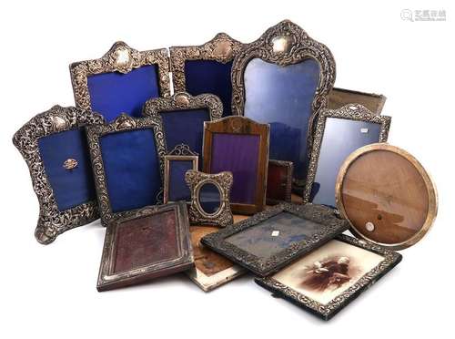 A collection of silver photograph frames, various …