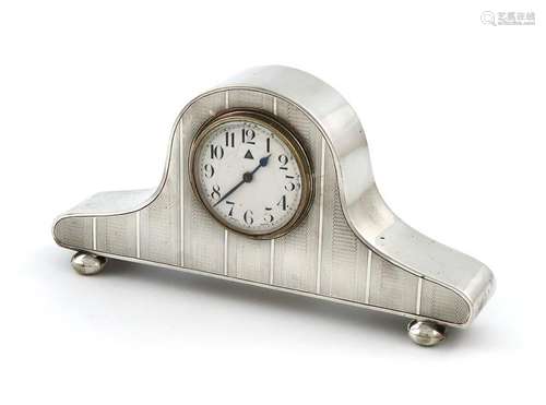 A silver mantle clock, by Charles S Green & Co Ltd…