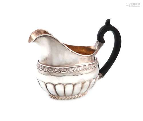 A 19th century Russian silver cream jug, marked E.…