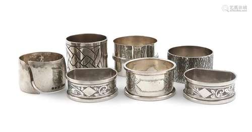 A small collection of seven silver napkin rings, v…