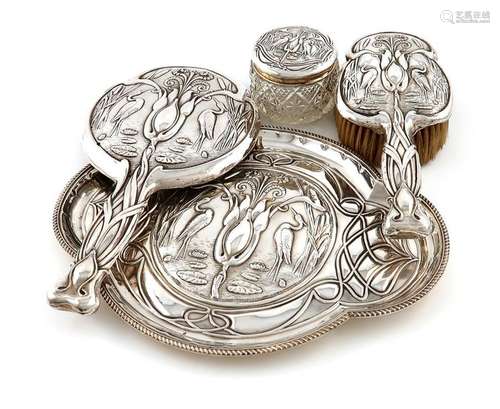 A four piece Edwardian silver Art Nouveau dressing…