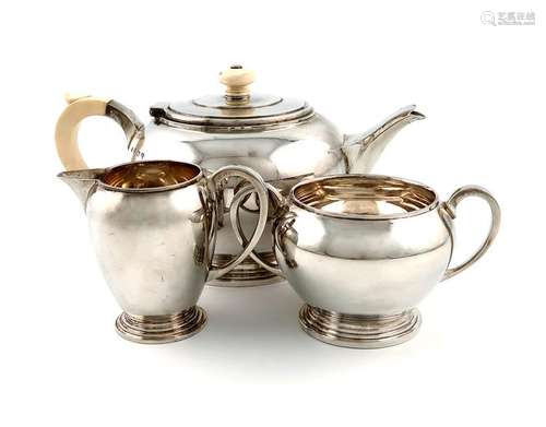 ΛA three piece Art Deco silver and ivory tea set, …