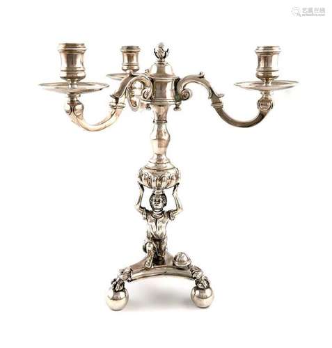 A silver candelabrum, with cancelled marks, and Lo…