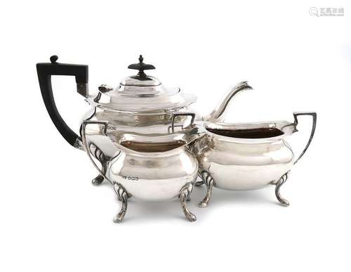 A three piece silver tea set, by Walker and Hall, …