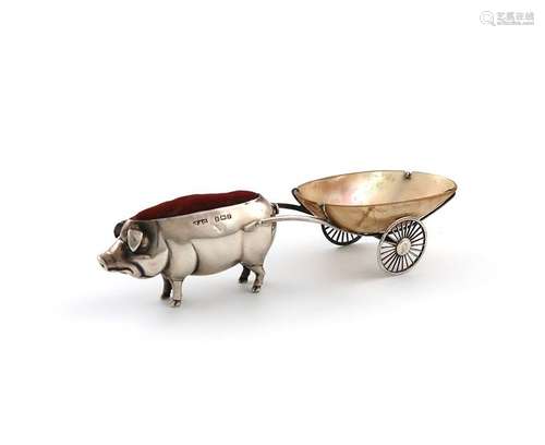 An Edwardian novelty silver pig and cart pin cushi…