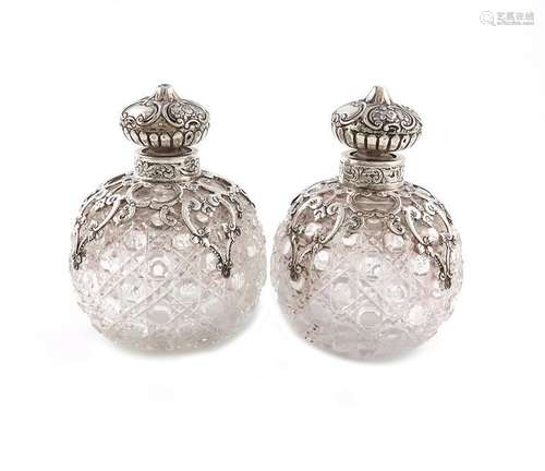 A pair of Victorian silver mounted cut glass scent…