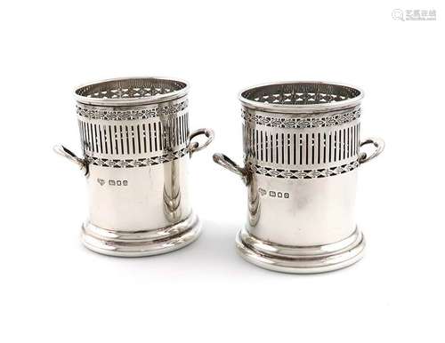 A pair of silver two handled sauce bottle holders,…