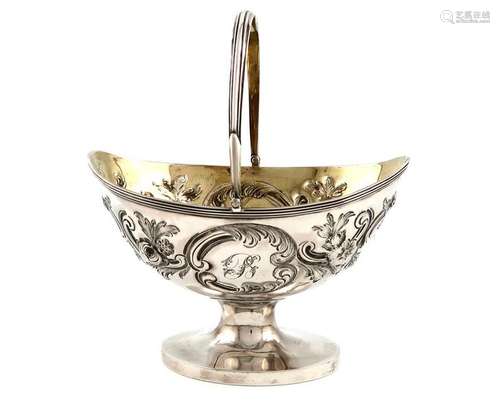 A George III silver swing handled sugar basket, by…