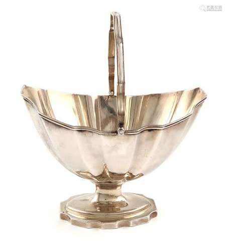 A George III silver swing handled sugar basket, by…