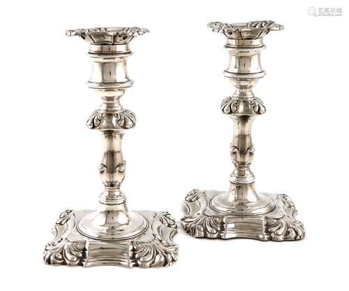 A pair of William IV silver candlesticks, by Henry…