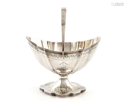 A George III silver swing handled sugar basket, by…