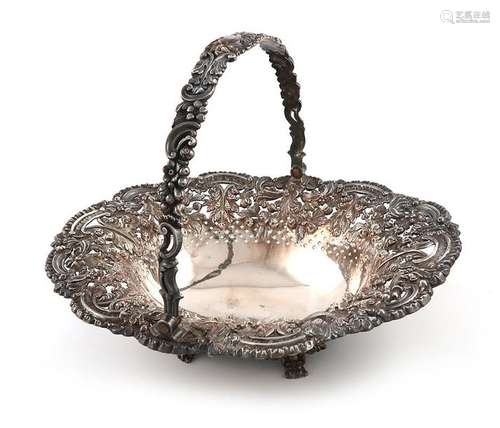 A George III silver swing handled cake basket, by …