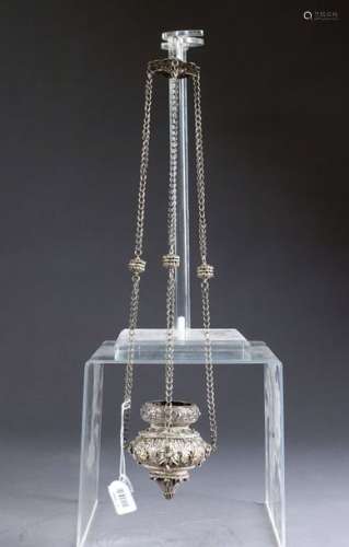 Votive lamp of baluster shape. Worn by three chain…