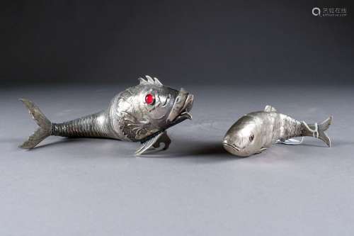 Two articulated fish. One with a movable head form…