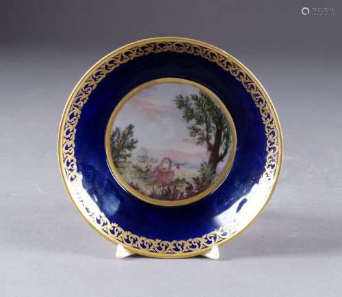 Saucer. Decorated with a landscape with a wicker b…