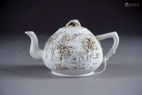 Teapot. With a moulded decoration, in relief, of a…