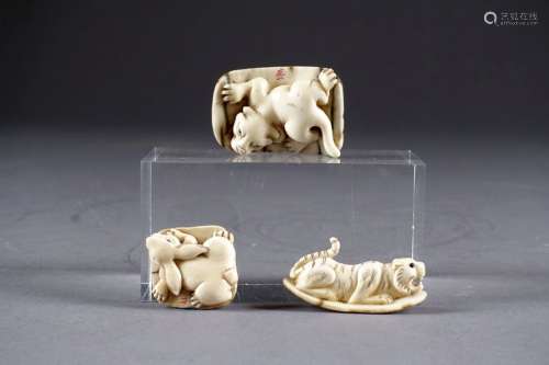 Three Netsukes. Carved mammoth ivory depicting a h…