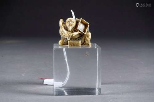 Netsuke. Shown here is an old man sitting with a b…