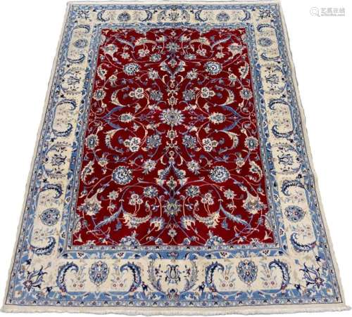 Nain carpet. The red background has flowery scroll…