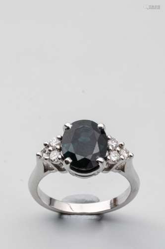 18k white gold ring surmounted by a sapphire of ab…