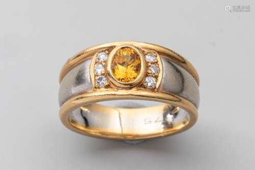Two gold band ring set with an oval cut yellow sap…