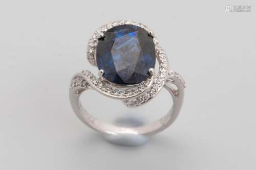 18k white gold ring set with an oval cut sapphire …