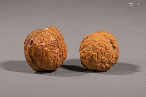 CHINA, circa 1980. Two finely carved walnuts of ch…