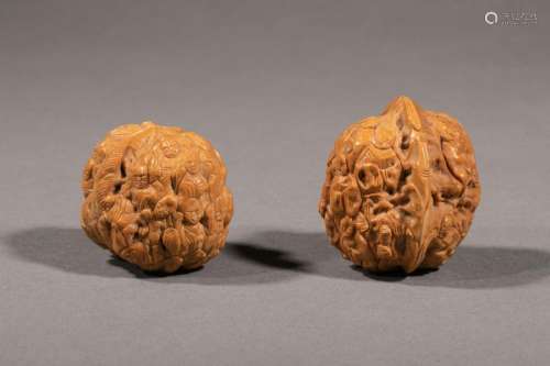 CHINA, circa 1980. Two finely carved walnuts of ch…