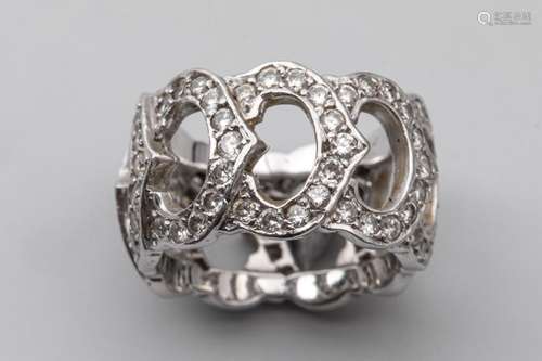 18k white gold openworked band ring set with a pav…