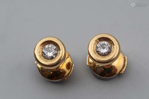 Pair of 18k yellow gold ear chips centered with a …