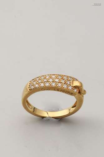GUY LAROCHE. 18k yellow gold belt ring surmounted …