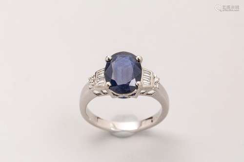 18k white gold ring set with an oval cut sapphire …